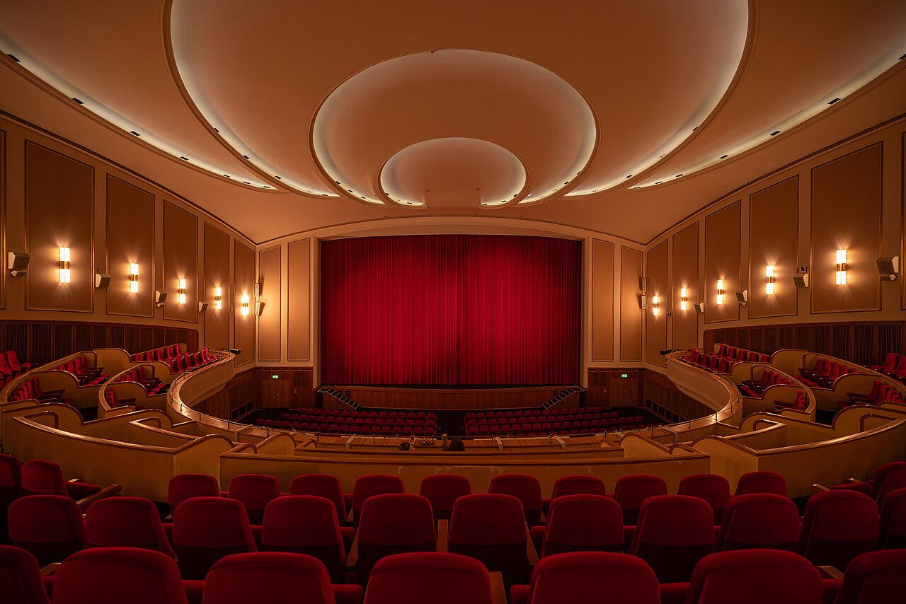 The auditorium of the Lichtburg cinema in Essen, with its red curtain